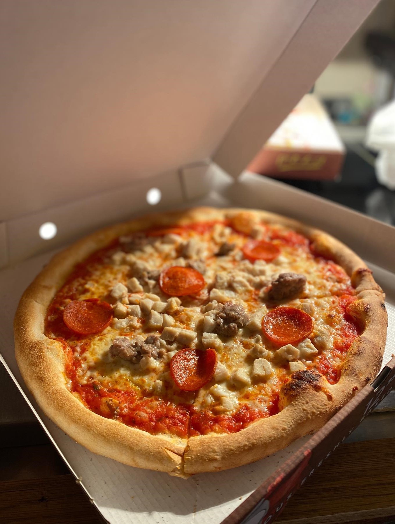 A freshly baked pizza with melted cheese and a golden crust